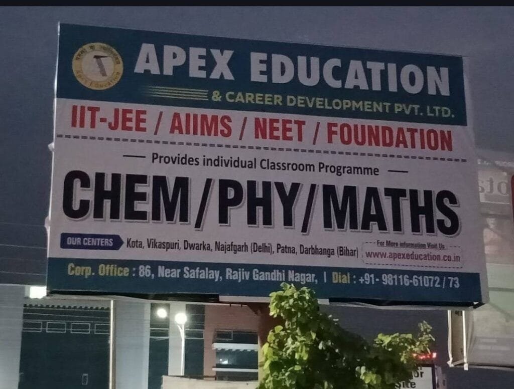 An outdoor billboard signboard for Apex Education & Career Development Pvt. Ltd. advertising individual classroom coaching programs for IIT-JEE, AIIMS, NEET, and Foundation courses. The sign emphasizes specialized subjects written in bold black text as "CHEM/PHY/MATHS," serving as a prominent hub for the top Chemistry classes in Dwarka, Gurugram & Delhi NCR. The design features a white billboard with dark blue and red headers, displaying the official circular institutional logo. This premier center for expert chemistry classes for JEE & NEET in Dwarka, Janakpuri, Gurugram & Delhi NCR explicitly lists operational center locations under "Our Centers" spanning Kota, Vikaspuri, Dwarka, Najafgarh (Delhi), Patna, and Darbhanga (Bihar). The footer details the Corporate Office at 86, Near Safalay, Rajiv Gandhi Nagar, Kota, along with the website apexeducation.co.in and primary helpline phone numbers +91-9811661072 / 73, establishing authority for Premium Chemistry classes in Janakpuri, Gurugram and Delhi NCR.